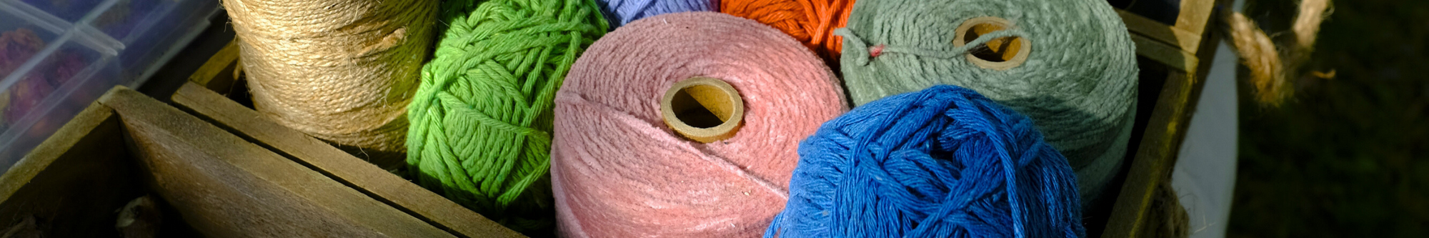 Colorful yarn balls in a wooden box